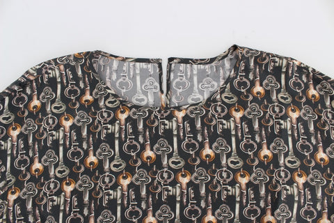 Gray silk blouse with gold key print from Dolce & Gabbana, featuring a stylish T-shirt design with a sleek, elegant look.