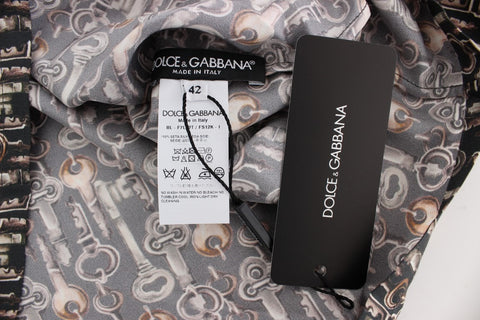 Gray silk blouse with gold key print from Dolce & Gabbana featuring a classic T-shirt style and elegant design.