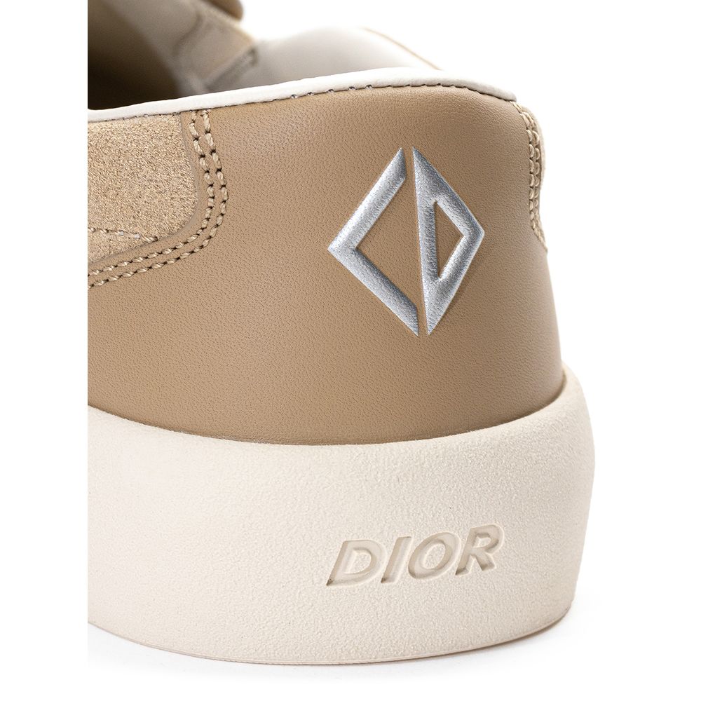 Dior beige leather slip-on loafers with sleek design, featuring smooth leather and classic silhouette for stylish footwear.