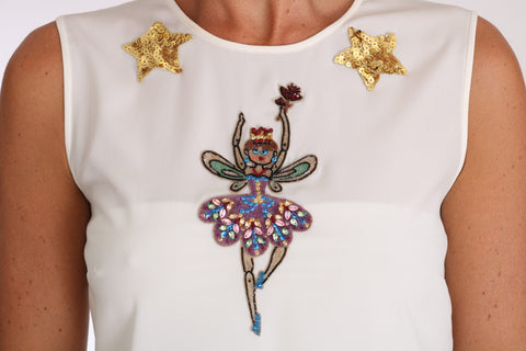 White silk fairy top with crystal embellishments and sequins by Dolce & Gabbana, featuring intricate detailing and a feminine design.