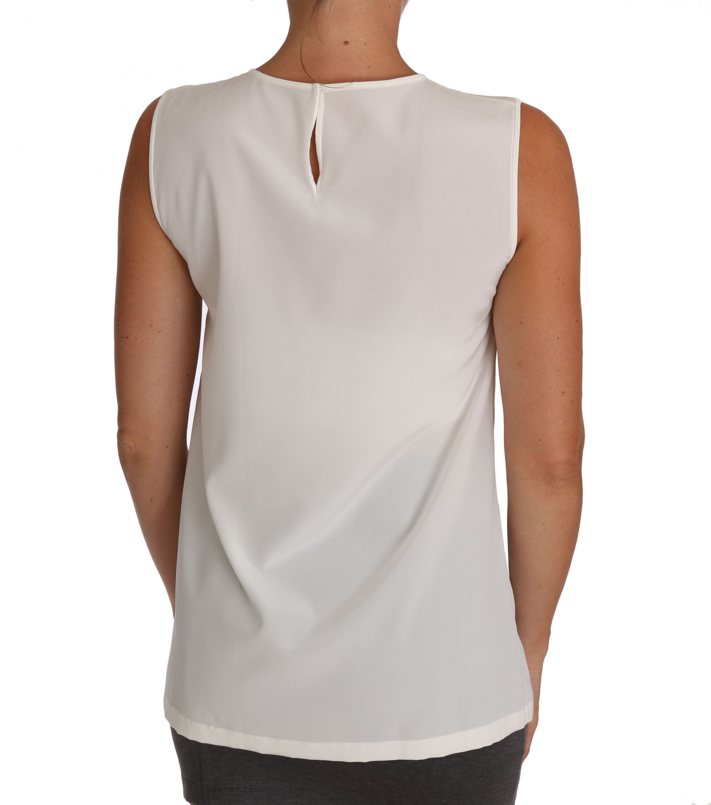 White silk fairy top by Dolce & Gabbana with crystal embellishments and sequin details, featuring a delicate, elegant design.