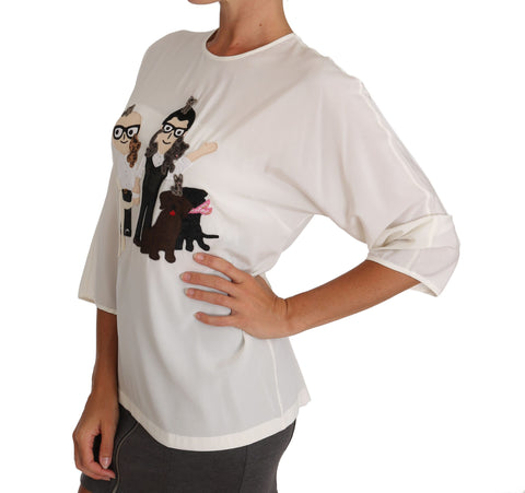 White silk blouse T-shirt with #dgfamily logo from Dolce & Gabbana, shown on a hanger with a smooth fabric texture.