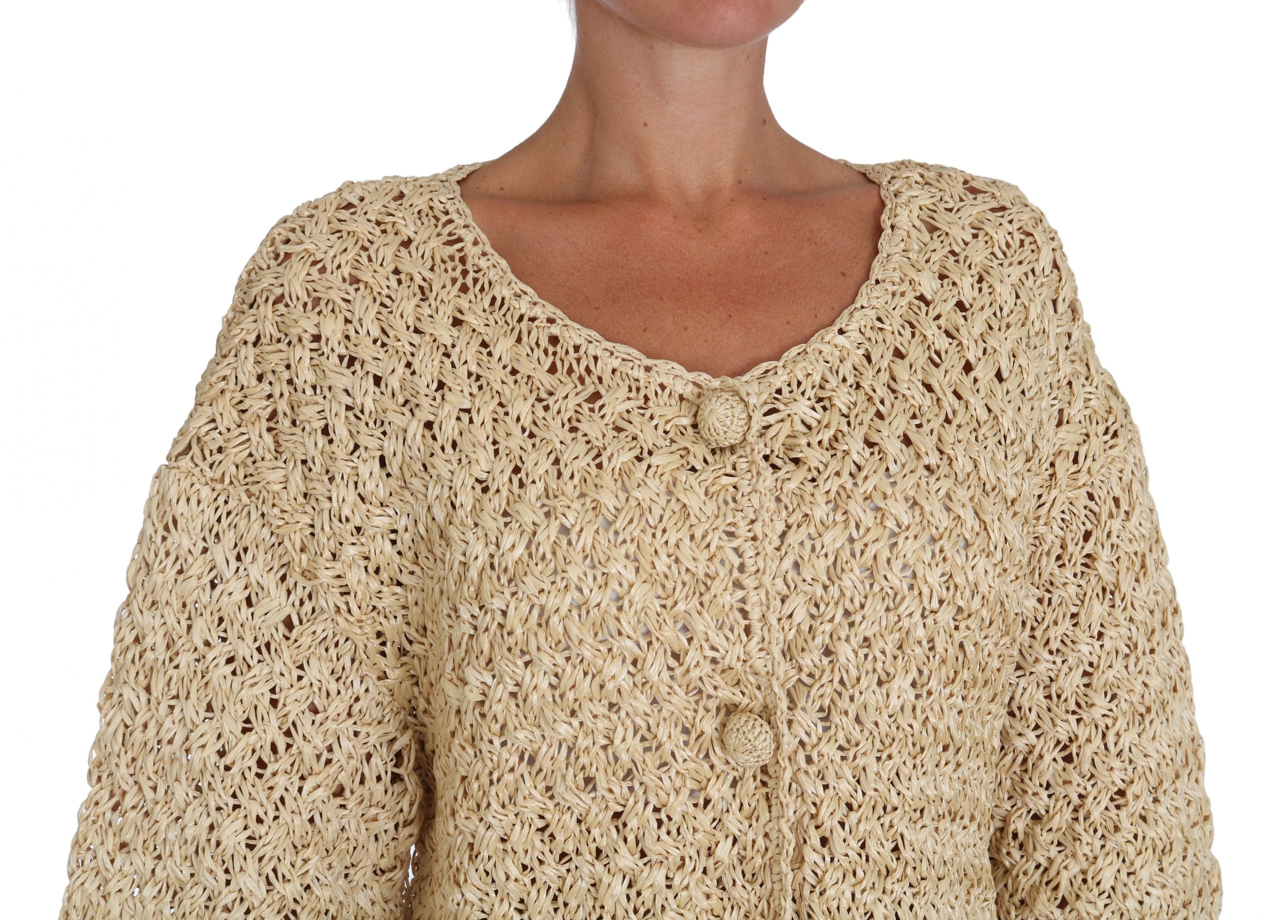 Beige crochet knitted raffia cardigan sweater by Dolce & Gabbana, showing detailed texture and relaxed fit.