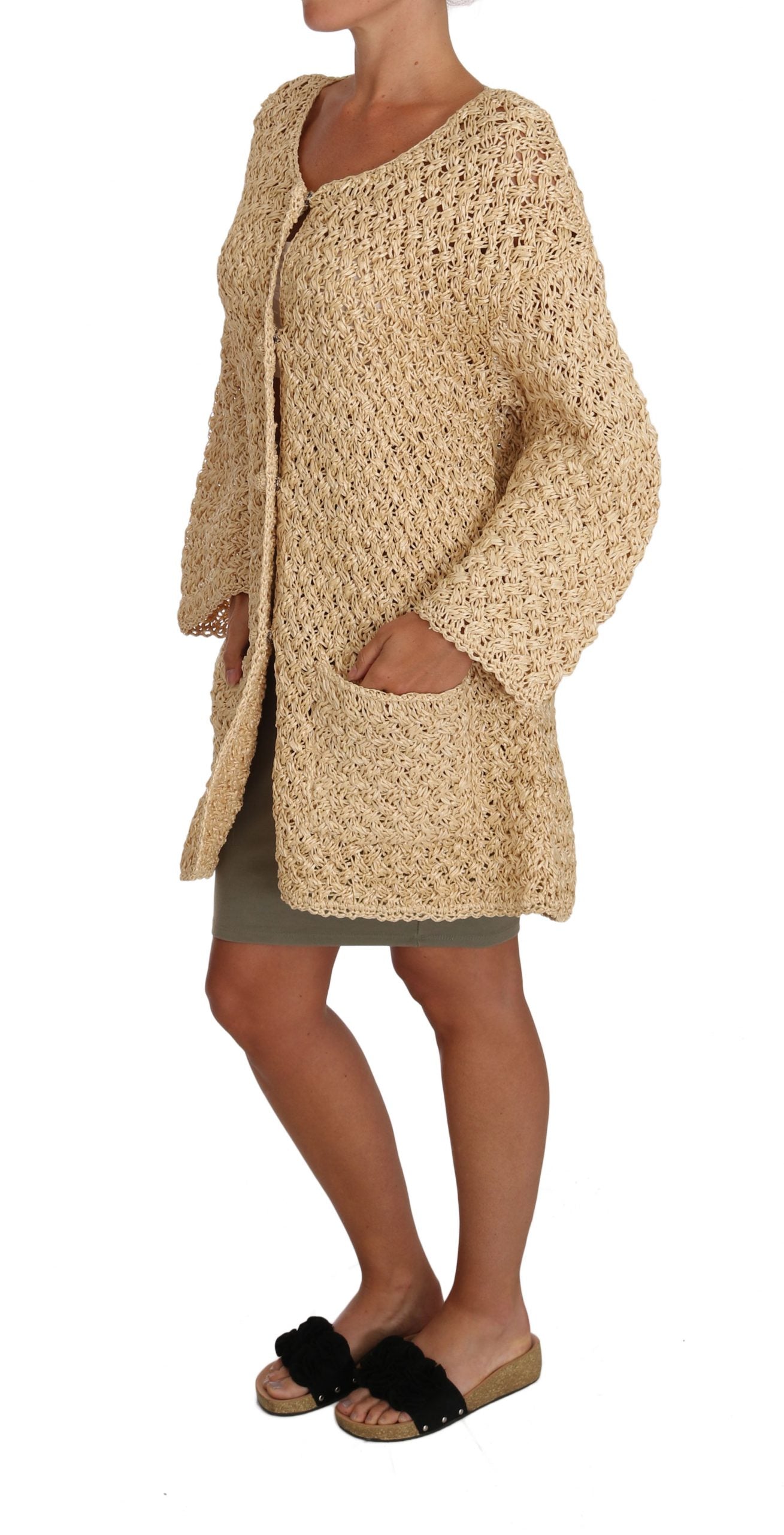 Beige crochet knitted cardigan sweater with raffia details by Dolce & Gabbana, shown on a neutral background.
