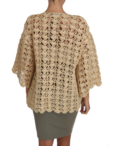 Beige crochet knitted cardigan sweater with raffia accents, Dolce & Gabbana, displayed on a mannequin.