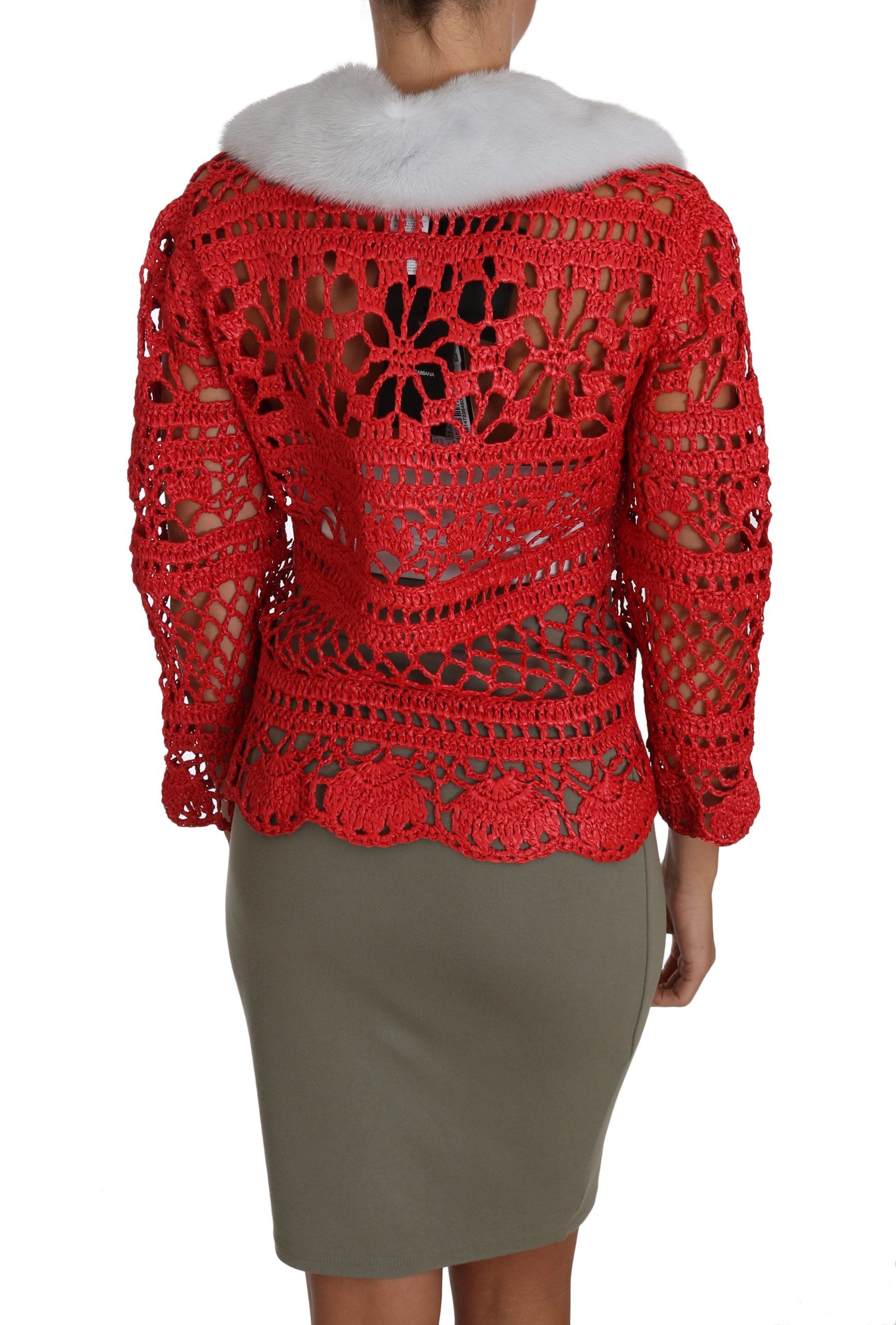 Red crochet knit cardigan with raffia accents, Dolce & Gabbana sweater featuring a textured, stylish design.