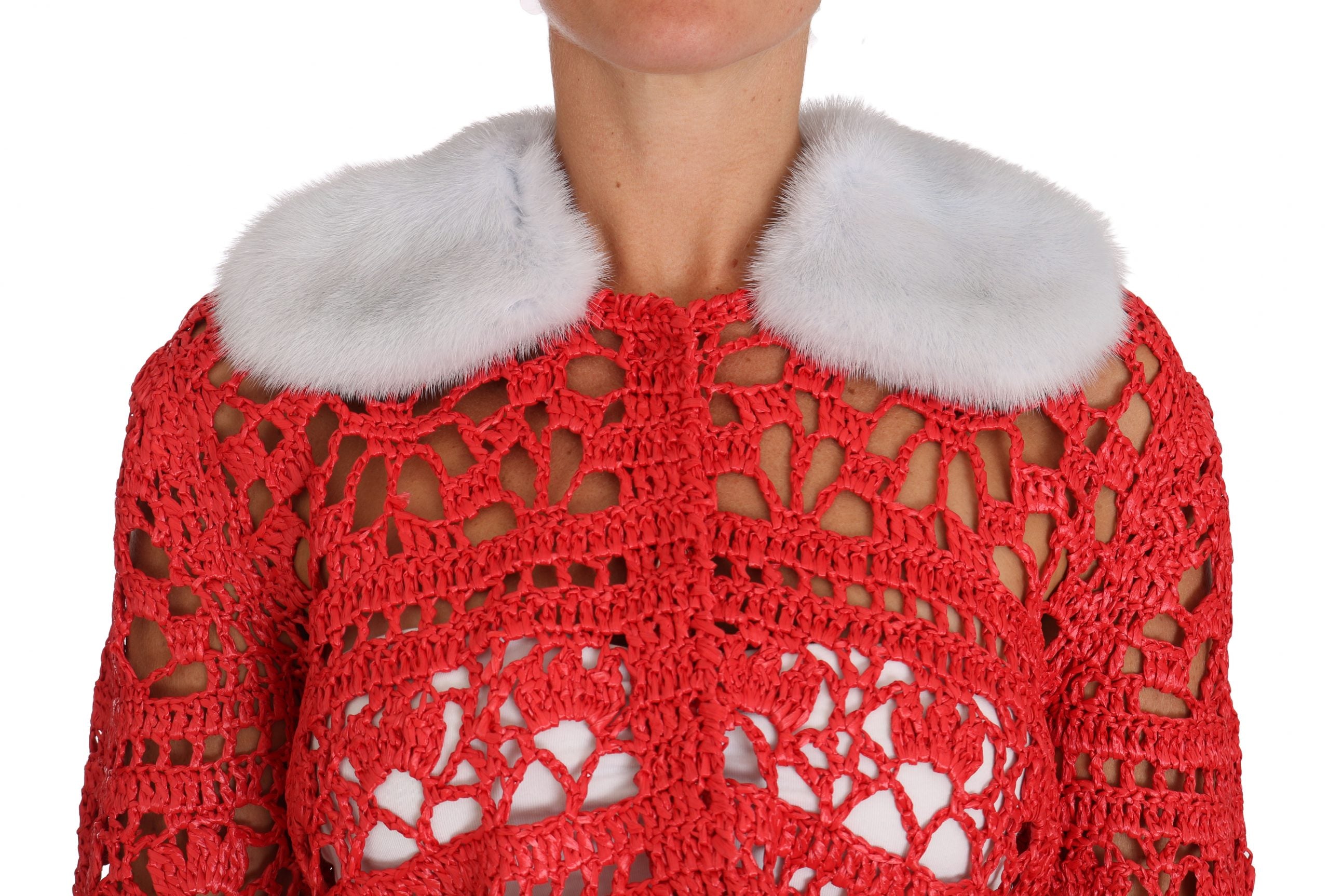 Red crochet knit cardigan sweater with raffia accents from Dolce & Gabbana, featuring a textured, bohemian-inspired design.