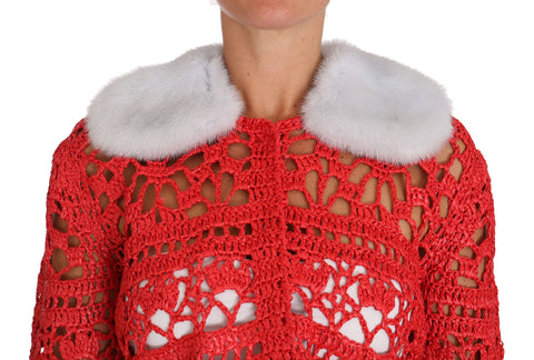 Red crochet knit cardigan sweater with raffia accents from Dolce & Gabbana, featuring a textured, bohemian-inspired design.