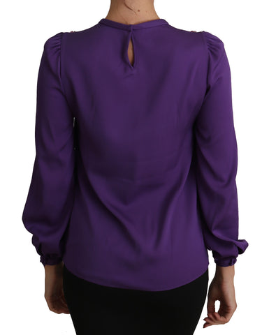 Purple Dolce & Gabbana blouse with fairy tale embellishments, featuring intricate embroidery and a stylish, flowy design.