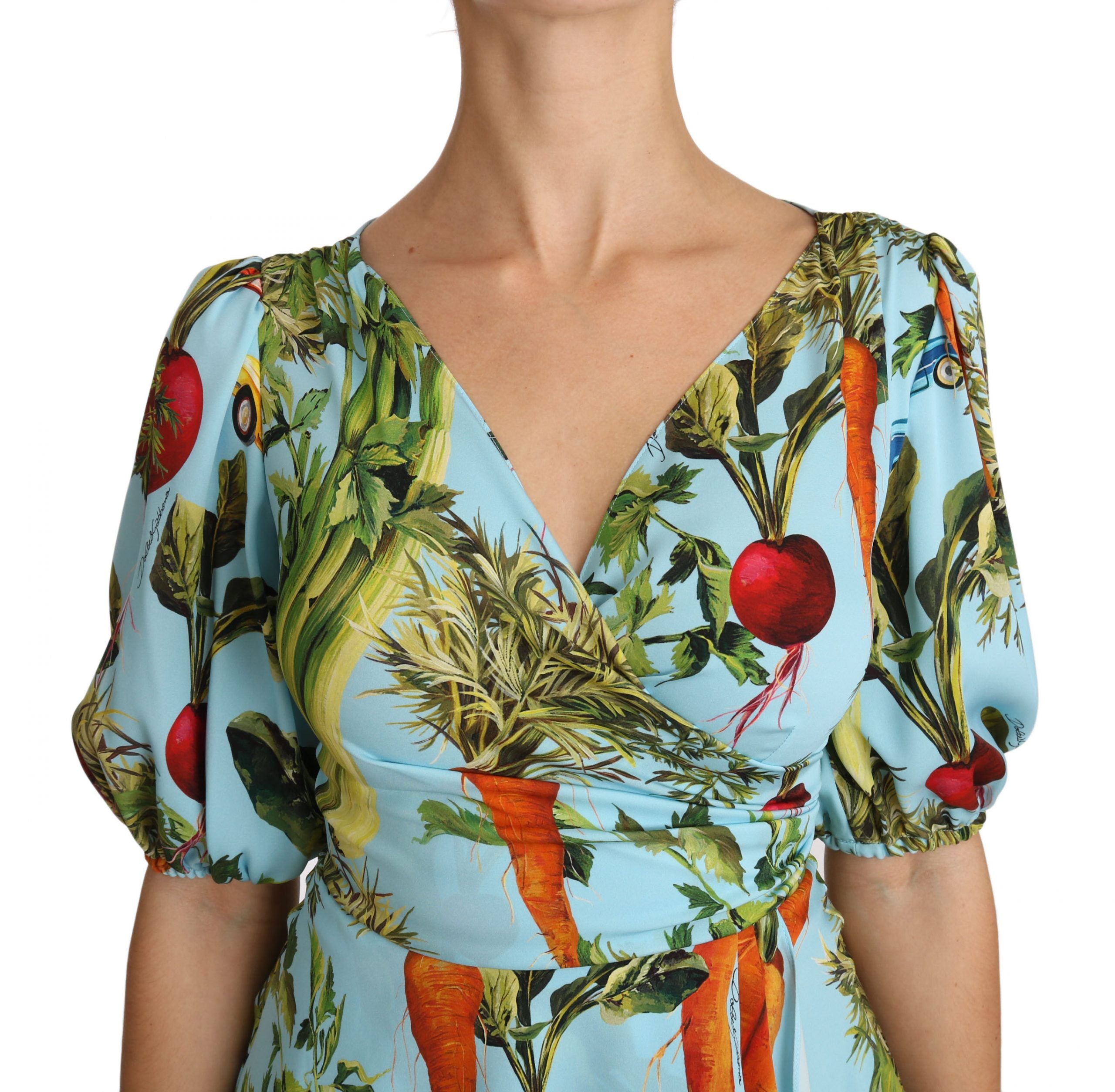 Multicolor vegetable print silk peplum wrap blouse by Dolce & Gabbana, featuring vibrant floral and vegetable motifs.