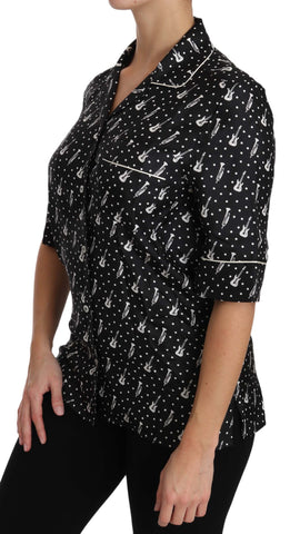Black silk shirt top with trumpet print from Dolce & Gabbana, showcasing a stylish, patterned long-sleeve design.