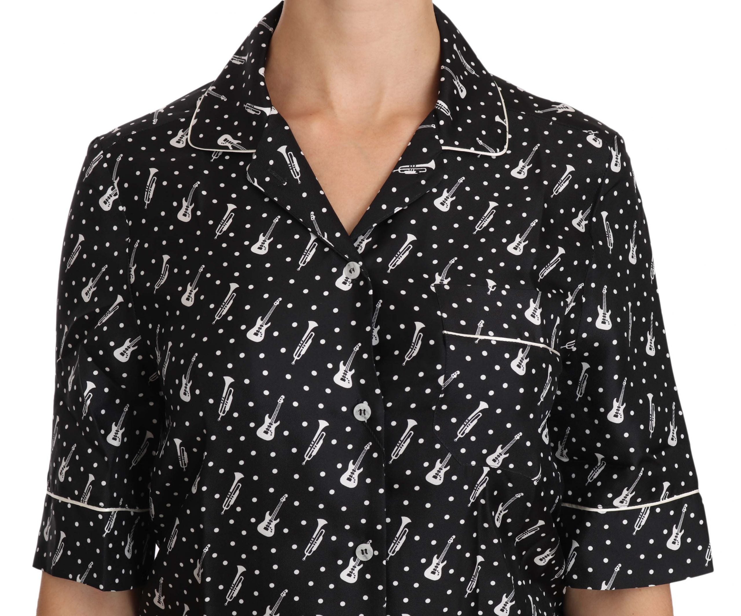 Black silk shirt top with guitar and trumpet print by Dolce & Gabbana, featuring a stylish, smooth fabric and vibrant musical instrument design.