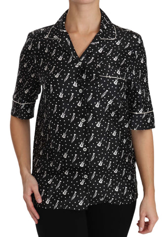 Black silk shirt top with guitar and trumpet print by Dolce & Gabbana, featuring a stylish, smooth fabric and classic collar.