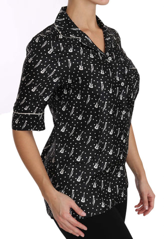 Black silk shirt top with trumpet print from Dolce & Gabbana, featuring a stylish, lightweight design and button closure.