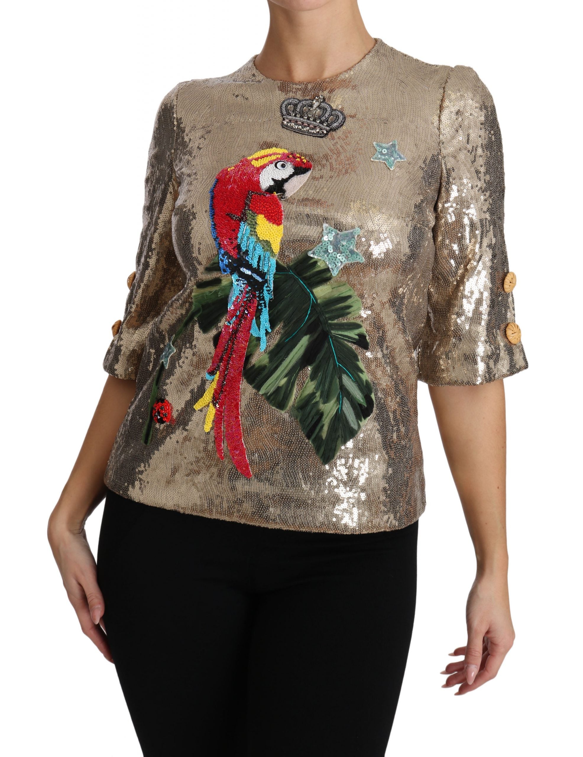 Gold sequined parrot crystal blouse by Dolce & Gabbana featuring vibrant bird embroidery and shimmering embellishments.