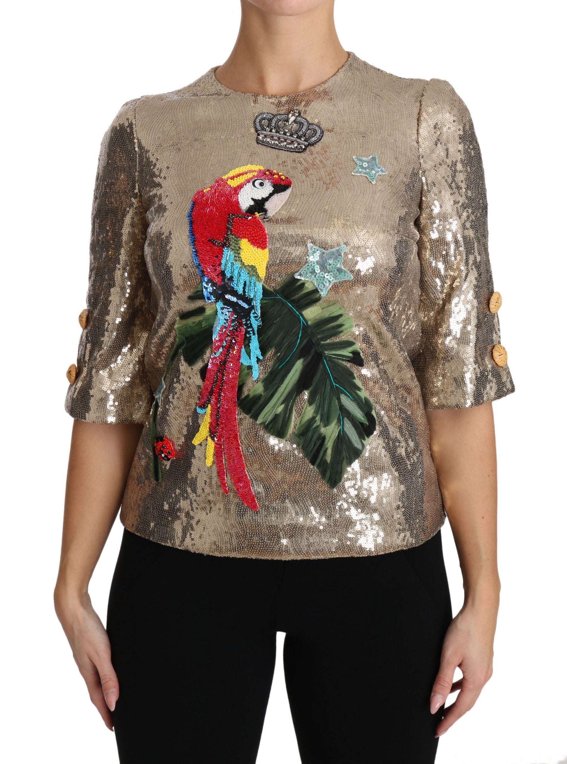Gold sequined parrot crystal blouse by Dolce & Gabbana featuring vibrant bird embroidery and shimmering embellishments.
