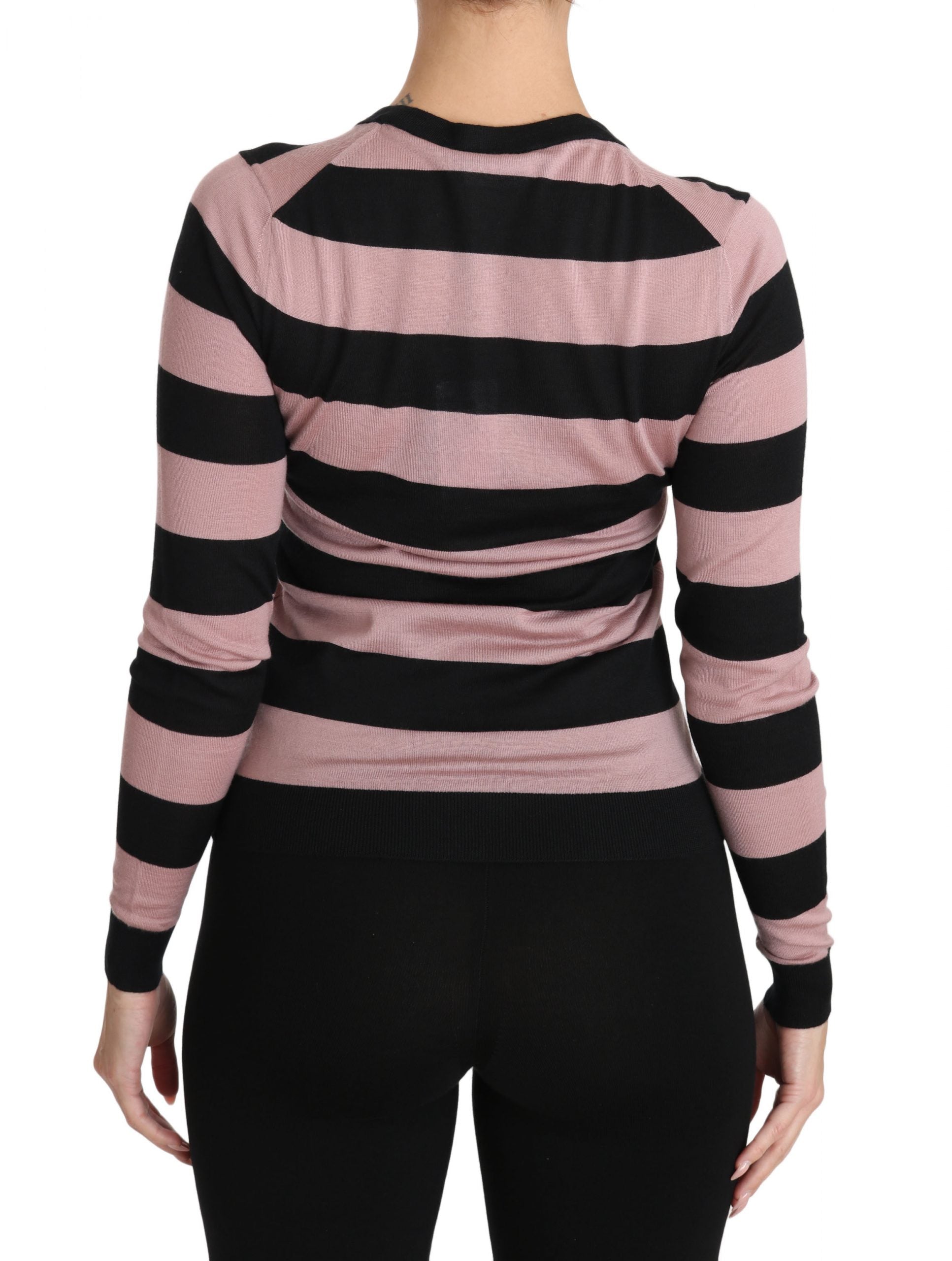 Pink floral cashmere cardigan sweater by Dolce & Gabbana with delicate floral patterns and a cozy, luxurious texture.