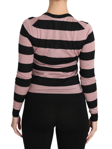 Pink floral cashmere cardigan sweater by Dolce & Gabbana with delicate floral patterns and a cozy, luxurious texture.