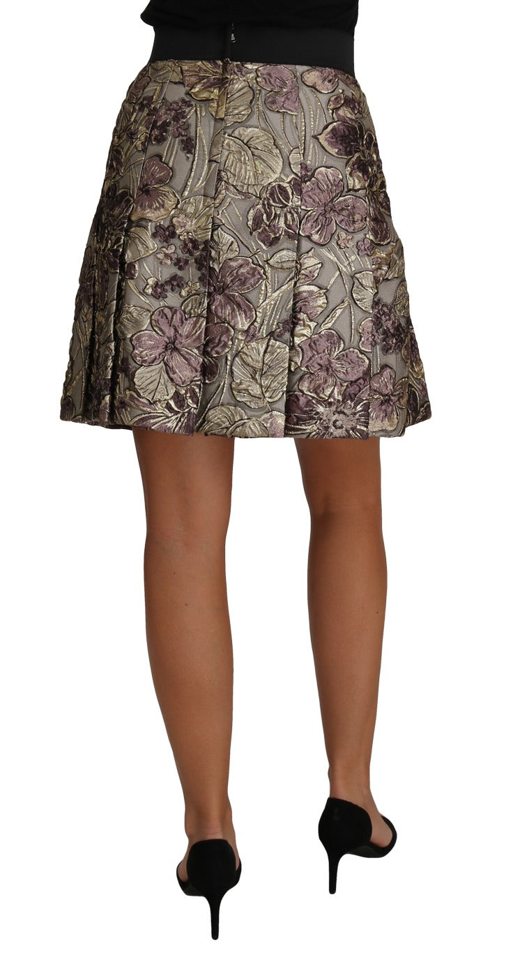 Dolce & Gabbana A-line mini skirt with floral print jacquard fabric, featuring a fitted waist and colorful floral pattern.