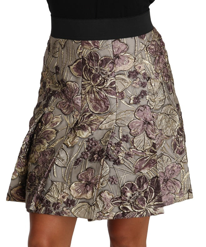 Dolce & Gabbana A-line mini floral print jacquard skirt displayed with a fitted waist and vibrant floral pattern.