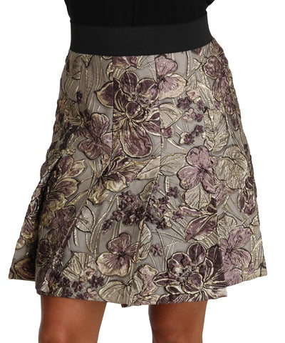 Dolce & Gabbana A-line mini floral print jacquard skirt displayed with a fitted waist and vibrant floral pattern.