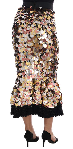 Gold sequined peplum high waist skirt by Dolce & Gabbana with shimmering fabric and structured peplum detail.