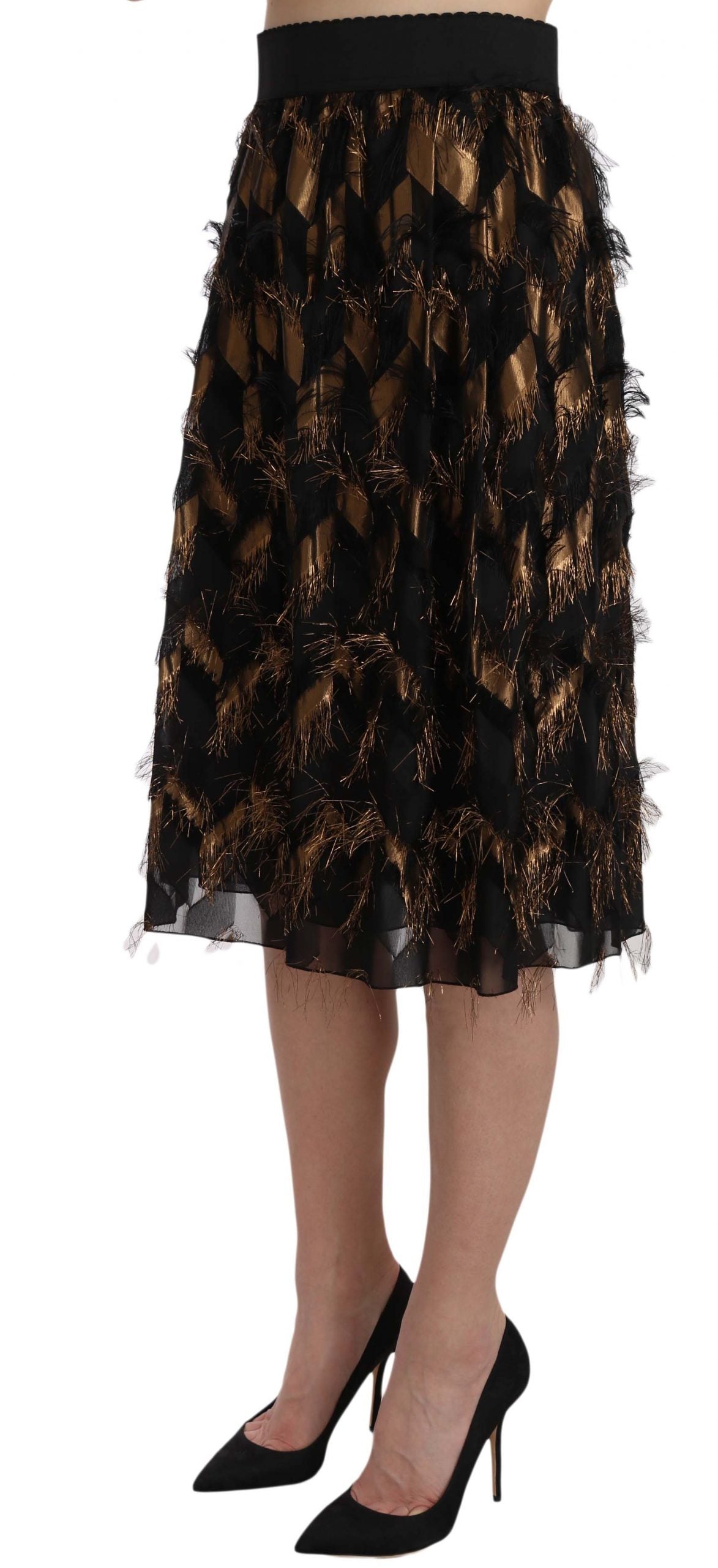 Black gold fringe metallic pencil A-line skirt by Dolce & Gabbana, featuring shiny gold fringe and sleek black fabric.
