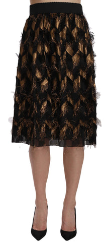 Black gold fringe metallic pencil A-line skirt by Dolce & Gabbana, featuring shiny gold fringe details and a sleek fit.