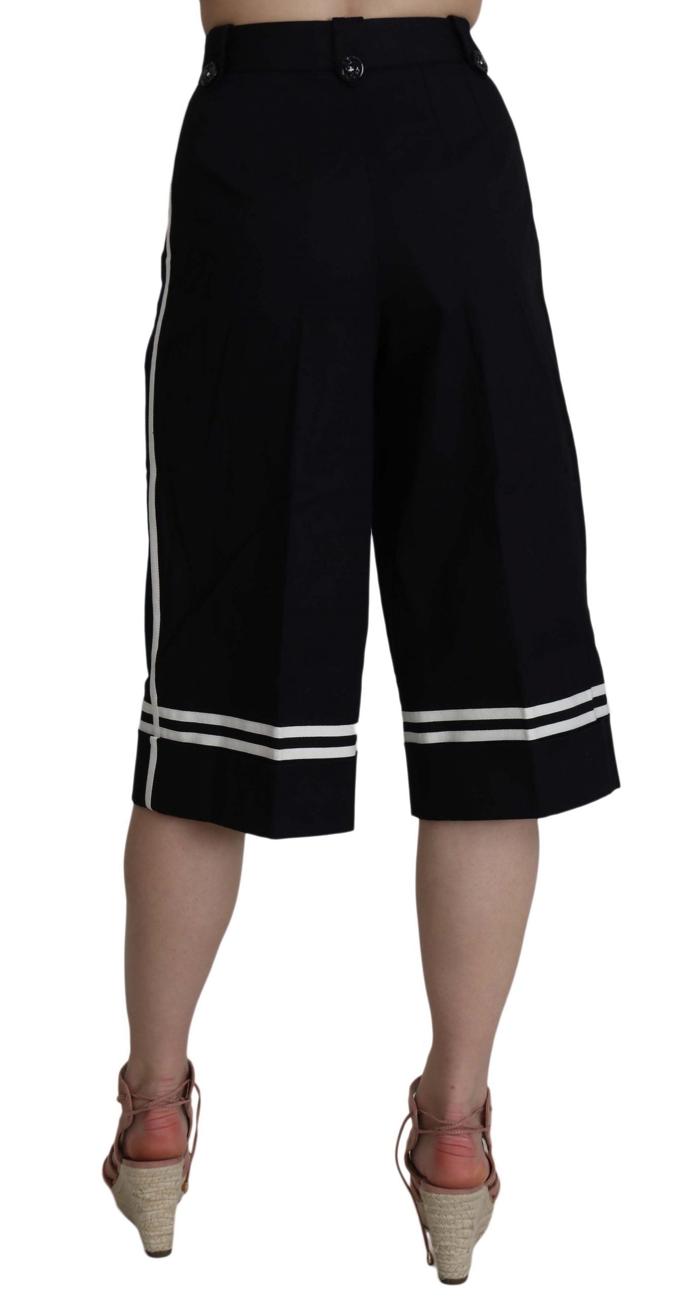Black cotton cropped pants with embellishments by Dolce & Gabbana, featuring intricate details and a tailored fit.