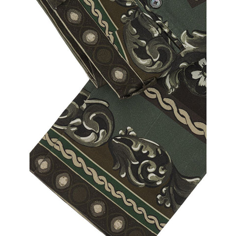 Green cotton casual pants by Dolce & Gabbana, showing relaxed fit and stylish design on a model.