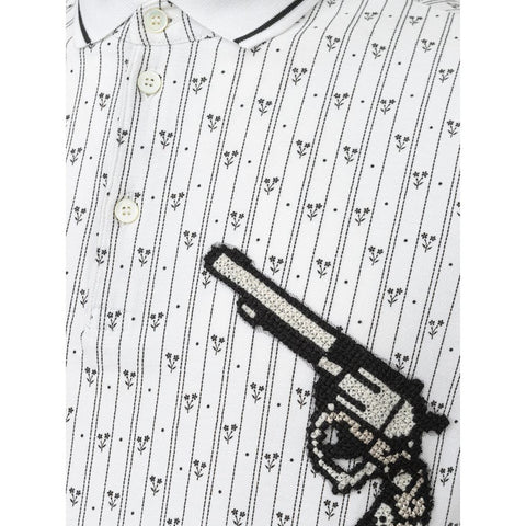 White cotton polo shirt by Jag Couture London New York, featuring a classic collar and short sleeves.
