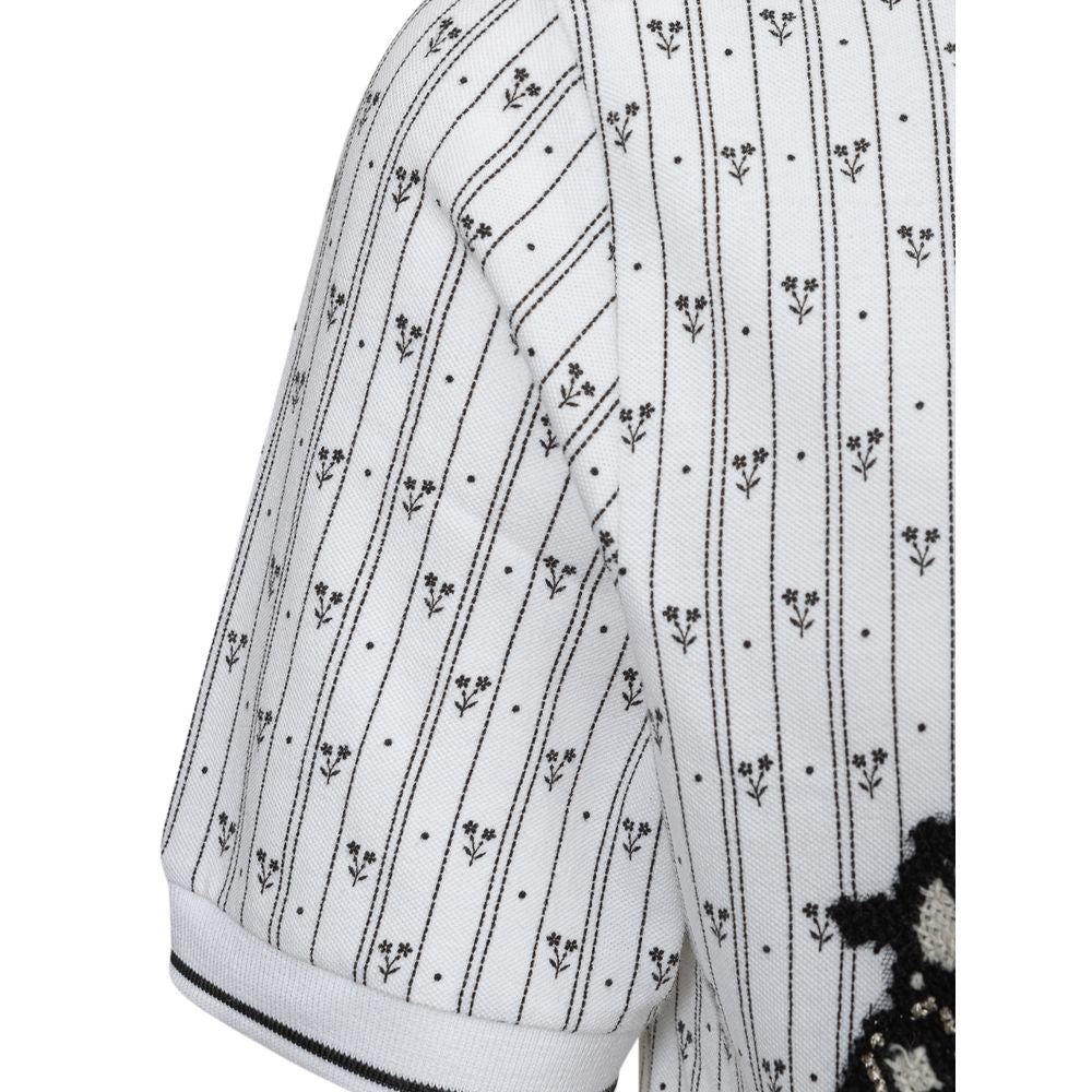 White cotton polo shirt from Jag Couture London - New York, featuring a classic collar and short sleeves.