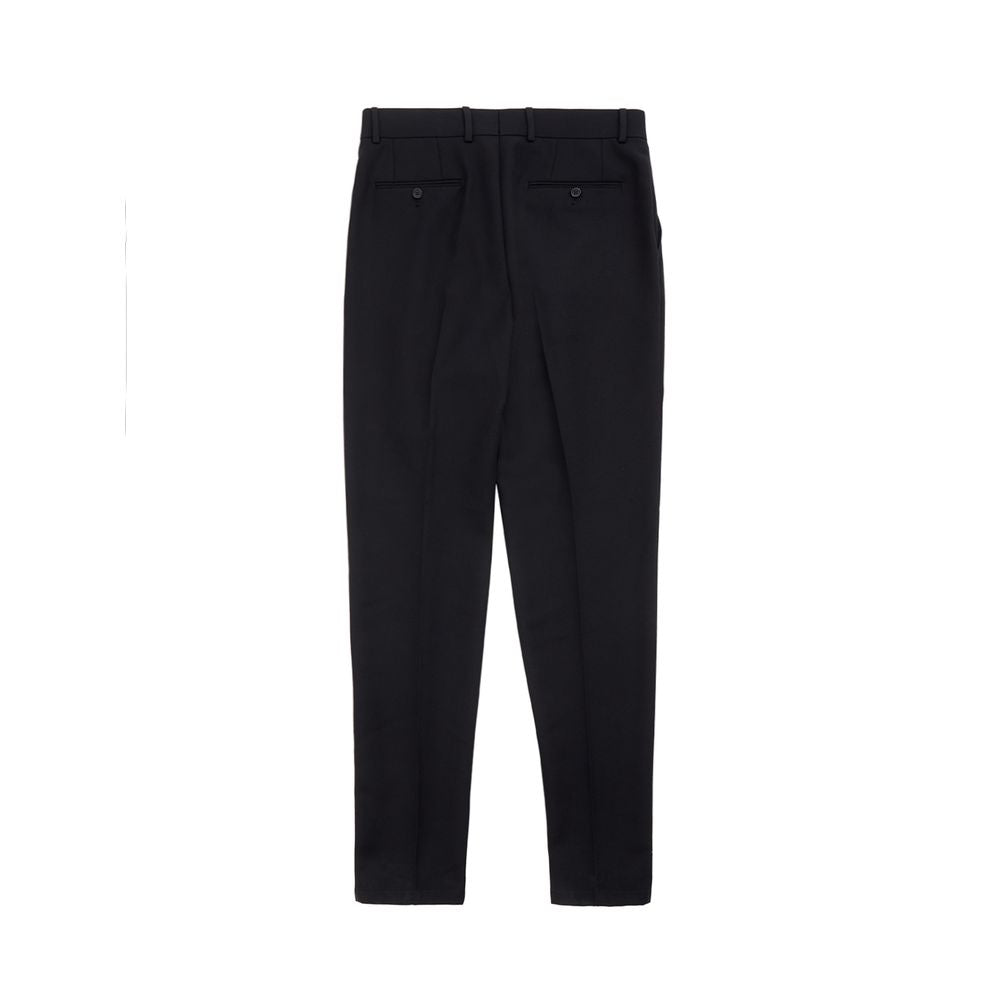 Black polyester dress pants by Dolce & Gabbana, tailored fit with sleek waistband and classic style, shown on a hanger.