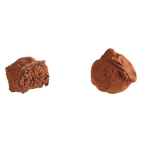 Dark cacao truffle with chili filling, 13g, by Jag Couture London New York, shown with rich chocolate exterior and spicy interior.