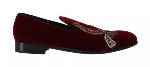 Dolce & Gabbana Bordeaux velvet loafers with gun horseshoe embellishments, stylish men's slip-on shoes, front view.
