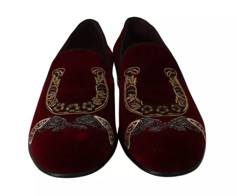 Dolce & Gabbana Bordeaux velvet loafers with gunmetal horseshoe detail, stylish men's slip-on footwear on a white background.