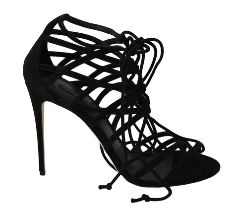 Black suede strap stilettos sandals by Dolce & Gabbana with high heels and elegant design, shown on a plain background.