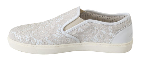White leather slip-on loafers shoes by Dolce & Gabbana with lace detailing and a sleek, minimalist design.