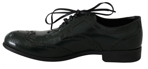 Green leather brogue Oxford wingtip shoes by Dolce & Gabbana with detailed wingtip stitching and classic lace-up design.