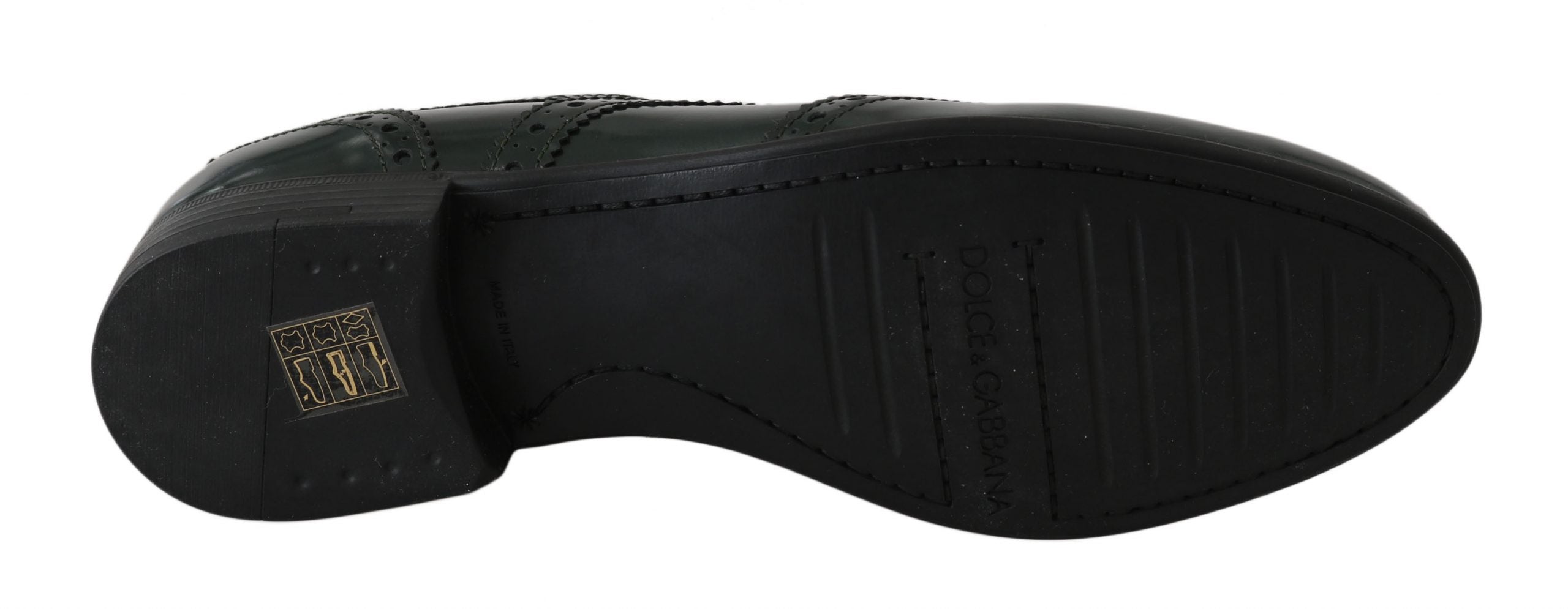 Green leather brogue oxford wingtip shoes by Dolce & Gabbana with detailed wingtip perforations and classic lace-up design.