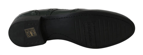 Green leather brogue oxford wingtip shoes by Dolce & Gabbana with detailed wingtip perforations and classic lace-up design.