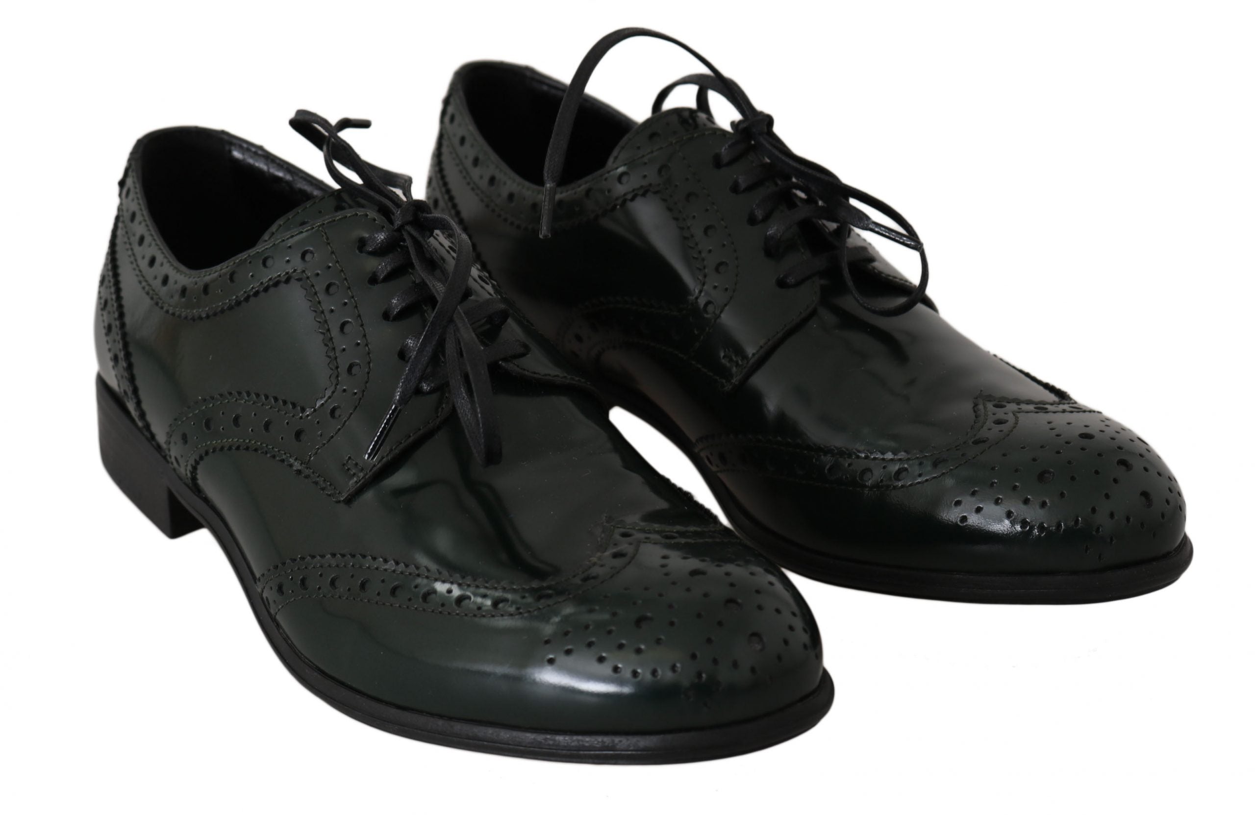 Green leather brogue oxford wingtip shoes by Dolce & Gabbana with detailed brogue patterns and classic wingtip design.