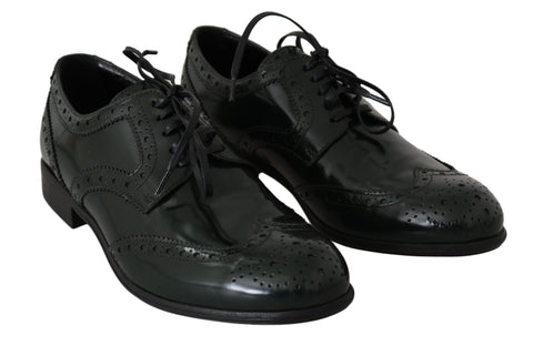 Green leather brogue oxford wingtip shoes by Dolce & Gabbana with detailed brogue patterns and classic wingtip design.
