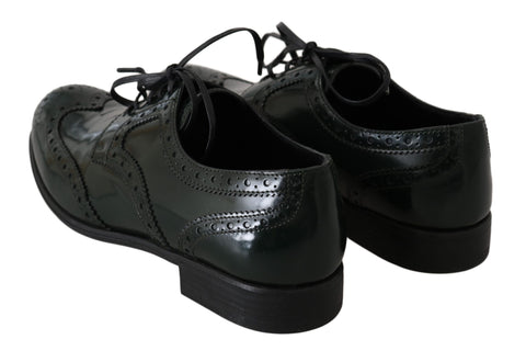 Green leather brogue oxford wingtip shoes by Dolce & Gabbana, showing detailed wingtip design and polished leather finish.