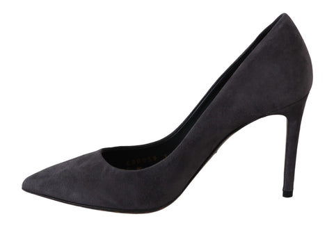 Gray suede leather stiletto heels by Dolce & Gabbana, featuring pointed toes and sleek design on a plain background.