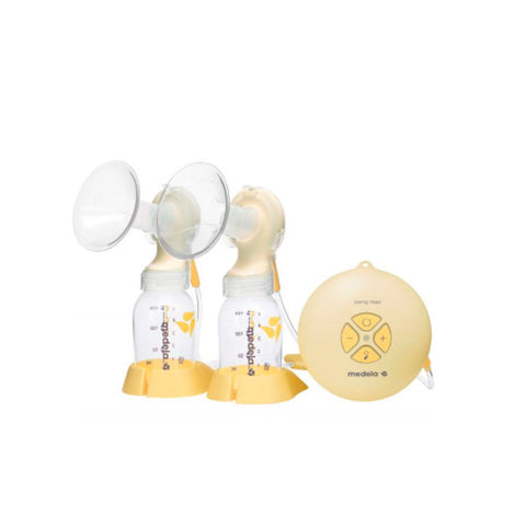 Jag Couture London - New York Medela Electric Breast Pump Duplo with dual pump flanges and control panels for efficient breastfeeding.