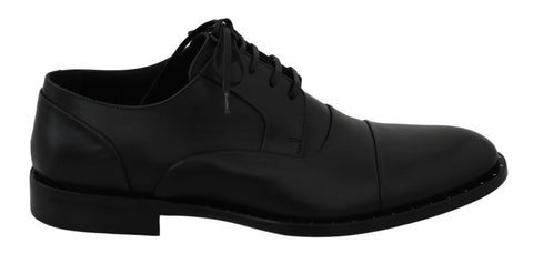 Black leather Derby formal shoes by Dolce & Gabbana featuring sleek design and classic lace-up style.