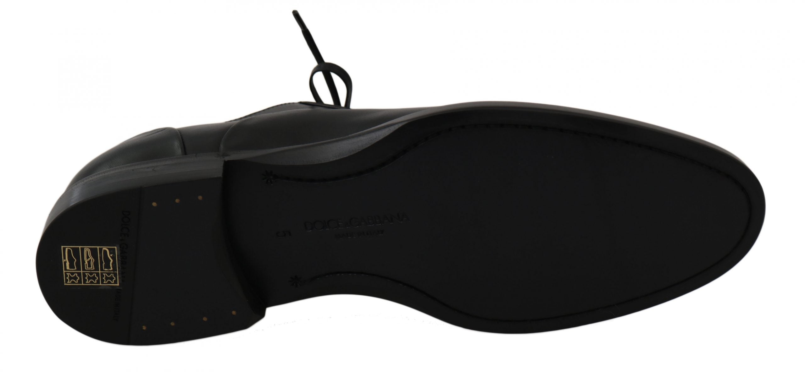 Black leather Derby formal shoes by Dolce & Gabbana shown on a white background, featuring sleek design and polished finish.
