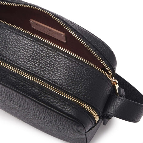Jag Couture London New York Coccinelle handbag in black leather with silver hardware and adjustable strap.