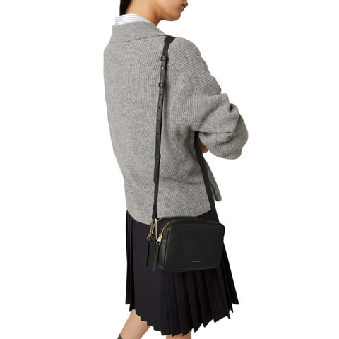Jag Couture London - New York Coccinelle handbag in black leather with silver hardware, featuring a structured shape and top handle.